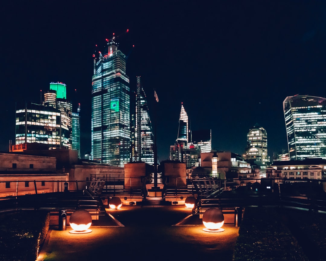 A rooftop bar in London with panoramic city skyline views at dusk