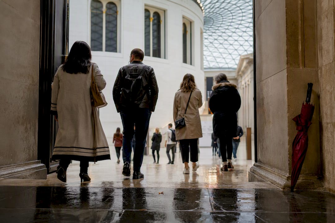 Visitors entering museum on rainy London day