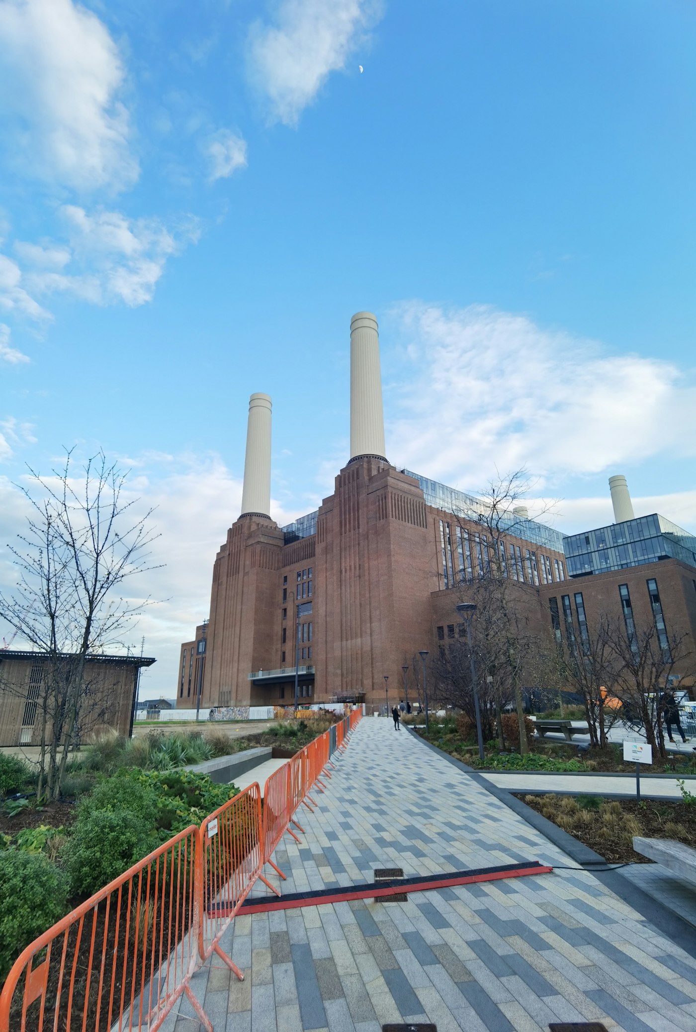 Battersea Power Station with its four iconic white chimneys reflected in the Thames, South London