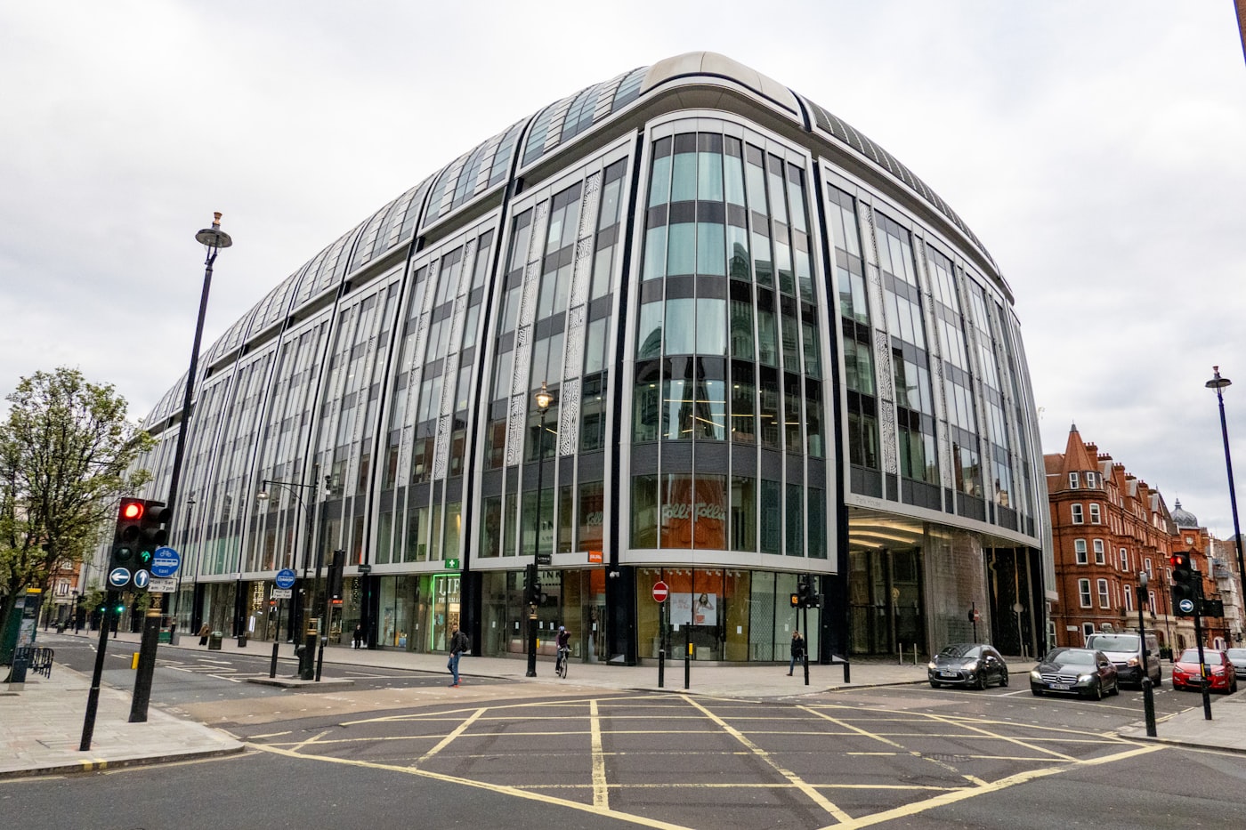 Oxford Street London with shoppers and iconic department store facades