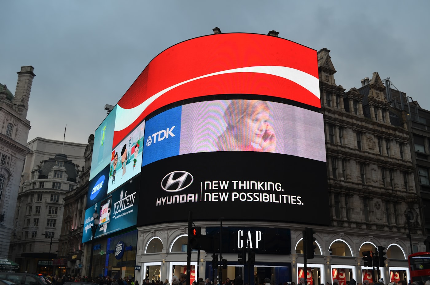Piccadilly Circus at night with illuminated advertising screens and the Shaftesbury Memorial Fountain, Central London